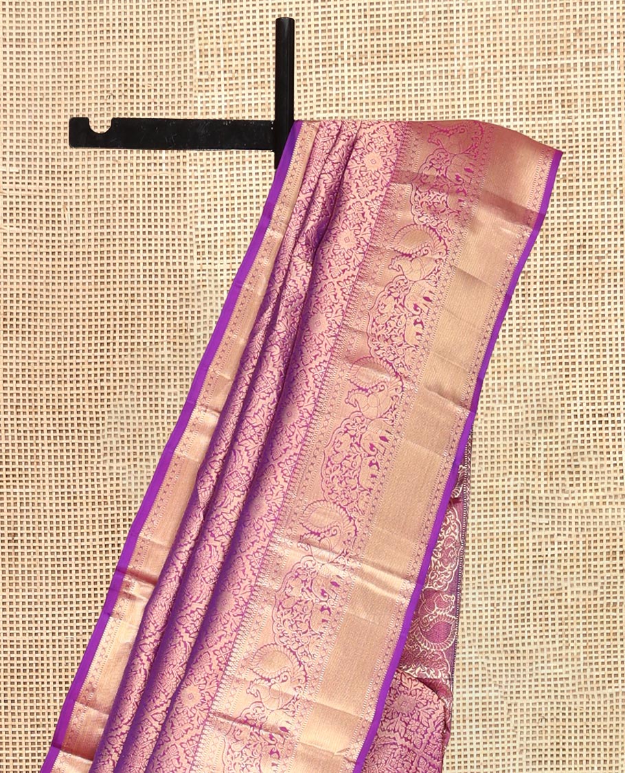 Pink Kanchipuram Wedding Silk Saree, Graced with Jacquard Design, a Zari Border of Thilakam Mokku, Muthu, Rudraksham, Yaanai and Mayil, Grand Pallu, and a Matching Blouse
