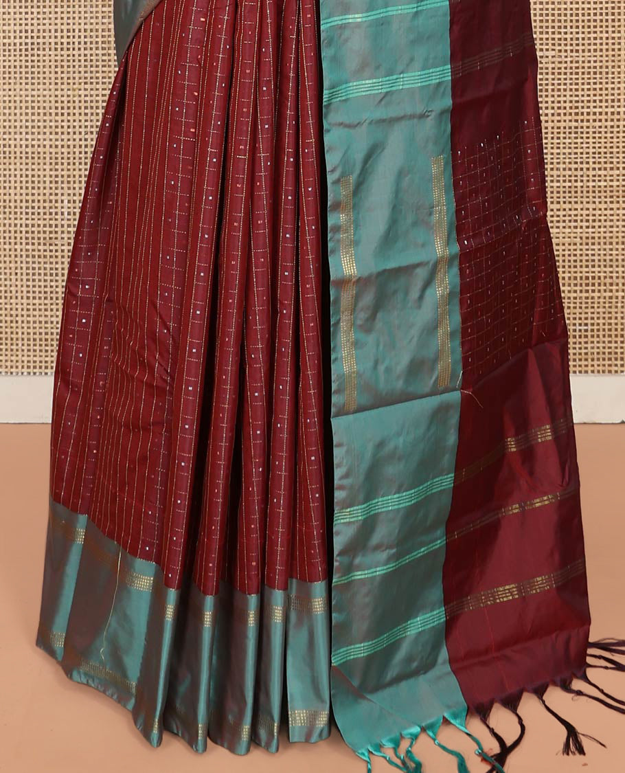 Maroon Aarani Silk Saree, Enriched with Butta Enclosed Checked Design on Its Body, Complemented by a Contrast Zari Striped Border, Pallu of Butta Enclosed Checks, and Paired with a Matching Blouse