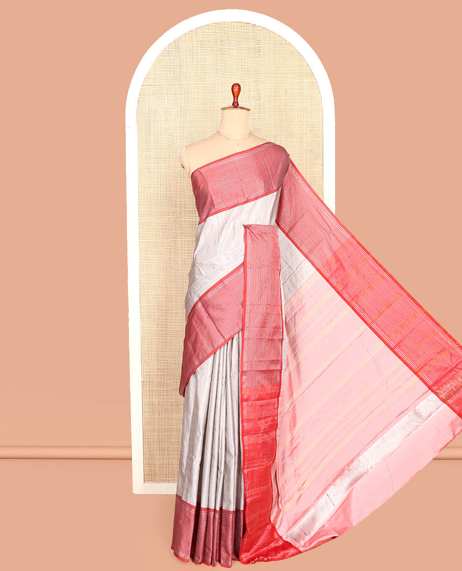 Grey Aarani Silk Saree, Subtly Sparkled with Zari Design All Over Its Body, Complemented by a Contrast Zari Striped Border, Striped Pallu, and Paired with a Matching Blouse