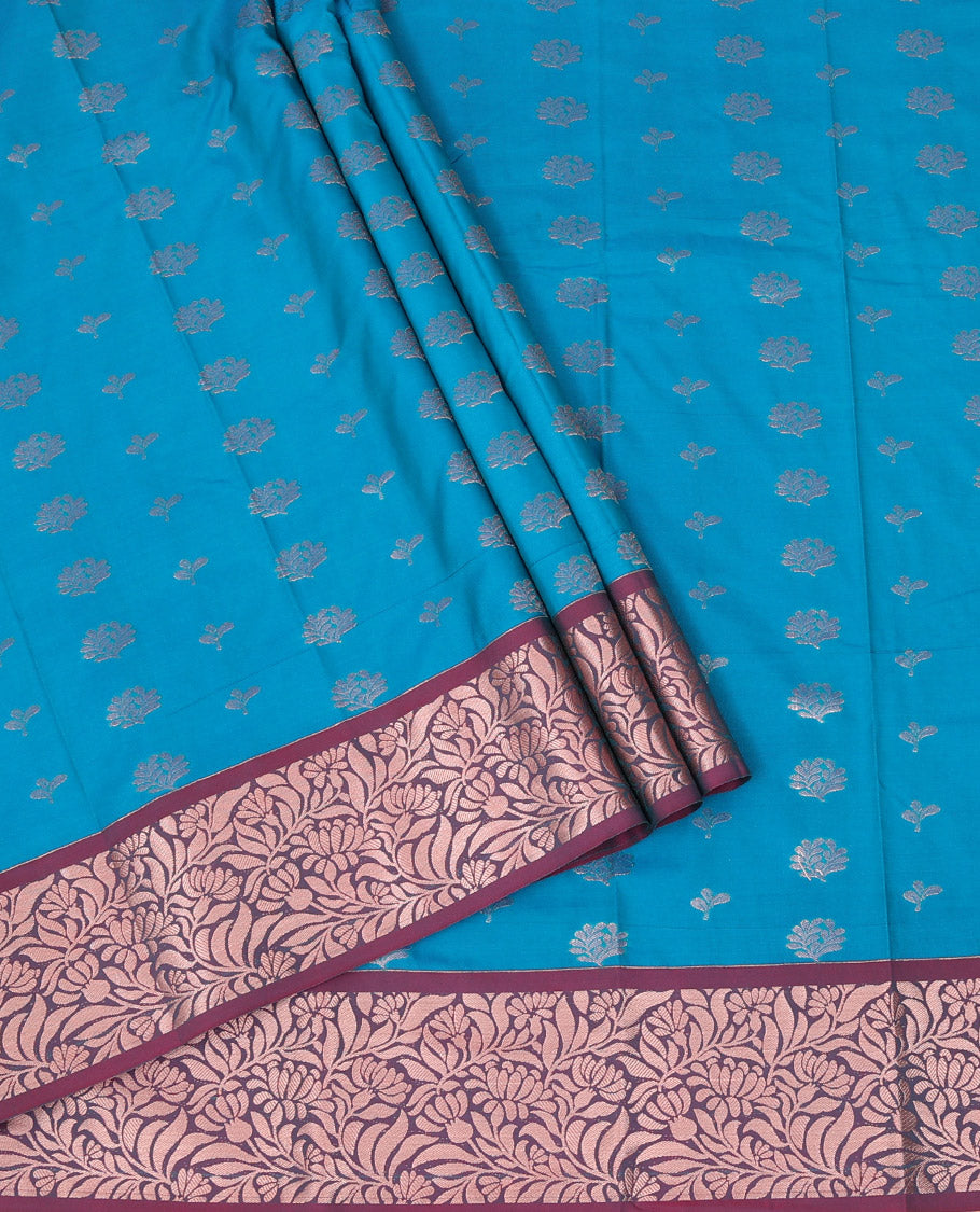 Blue Art Silk Pavadai Material Set, Woven with Floral Zari Buttas All Over Its Skirt, Highlighted with a Contrast Floral Jaal Zari Design Border, and Paired with a Contrast Blouse