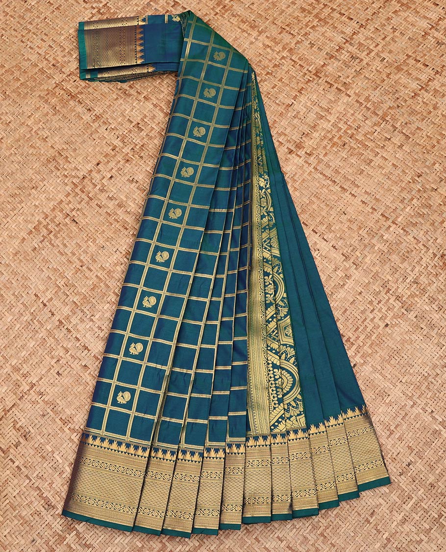 Blue Budget Silk Saree, Elegantly Detailed with Peacock-Chakram Butta Enclosed Checks All Over Its Body, Highlighted by a Temple Zari Border of Traditional Designs, Pallu Depicts Mughal-Style Designs, and Paired with a Matching Blouse