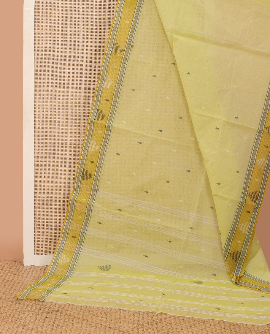 Pastel yellow buttas Bengal cotton saree, contrast temple border & pallu of stripes & buttas
