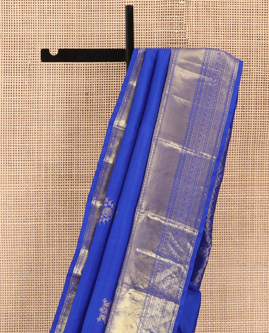 Royal blue zari buttas woven Kanchipuram silk saree, zari border of thilakam mokku, muthu, rudraksham, kodi visiry, chakram, and kathir designs, and jaal pallu
