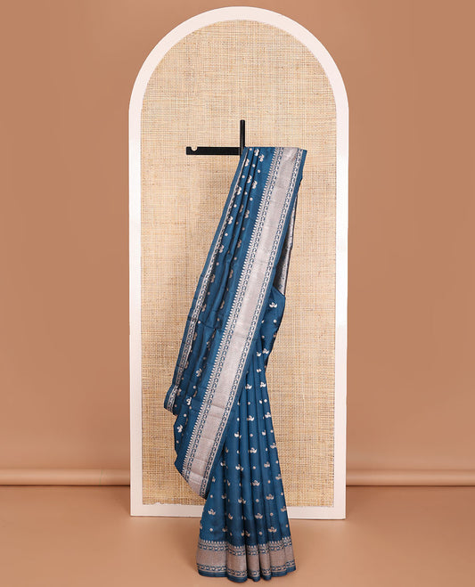 Blue raw mango silk saree with swan & flower buttas, traditional zari border & floral design pallu