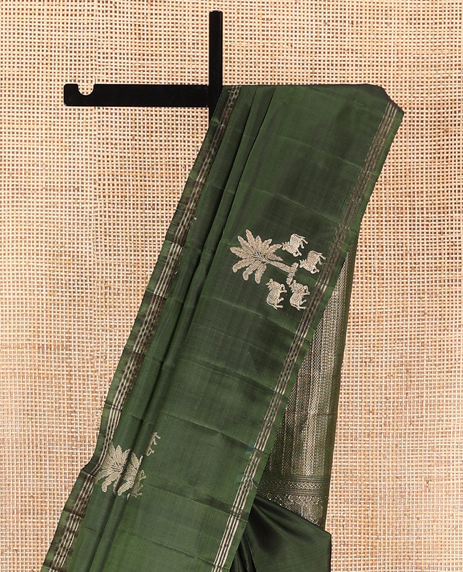 Green pichwai cow motifs soft silk saree, zari piping border, and pallu of geometric designs