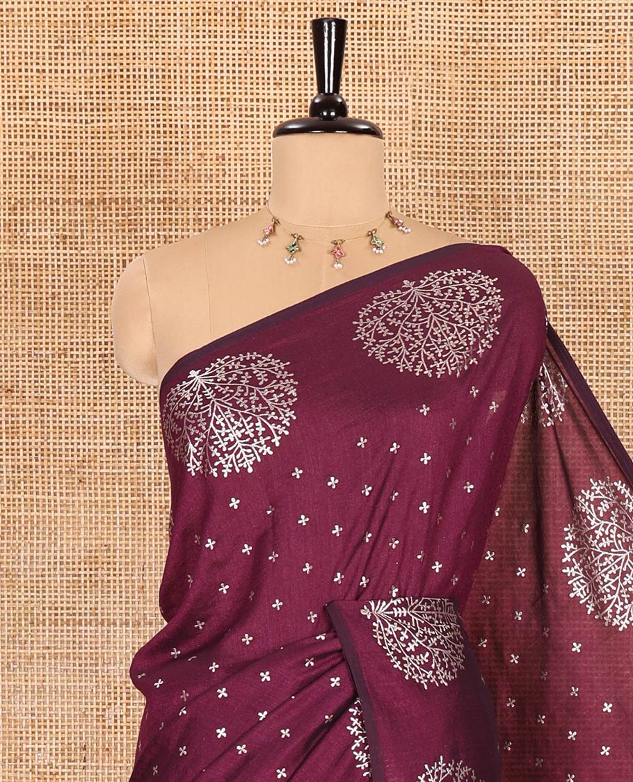 Wine plus buttas woven Vichitra silk saree, kalpavriksha tree motifs woven on its border, self-pallu, and no blouse