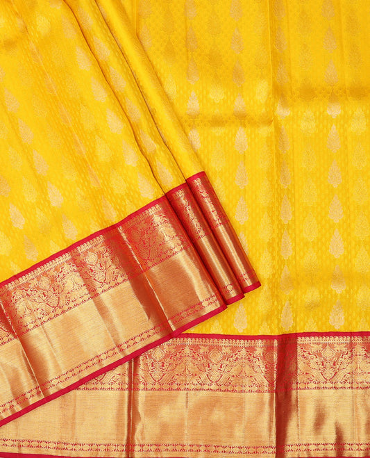 Yellow pure silk half-saree, zari buttas skirt, contrast border & blouse of manga,Muthu,kuthirai, rudraksha,yaanai & mayil & zari design dhavani