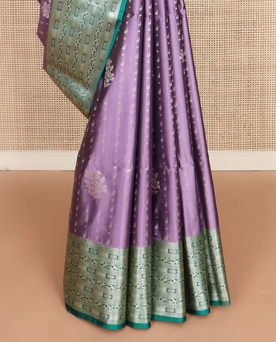 Purple floral buttas soft silk saree, contrast traditional zari design border, and pallu of geometric patterns