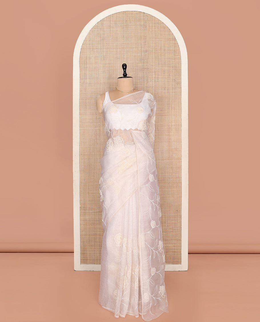 Off-white Crushed Tissue Saree, Delicately Decked Up with Floral Vine Embroidery, a Subtle Scallop Border, and Matching Blouse