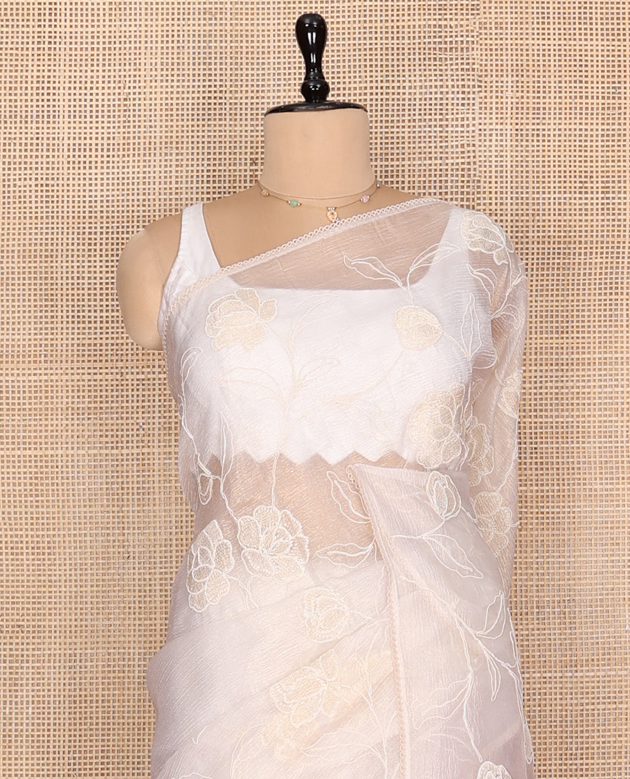Off-white Crushed Tissue Saree, Delicately Decked Up with Floral Vine Embroidery, a Subtle Scallop Border, and Matching Blouse