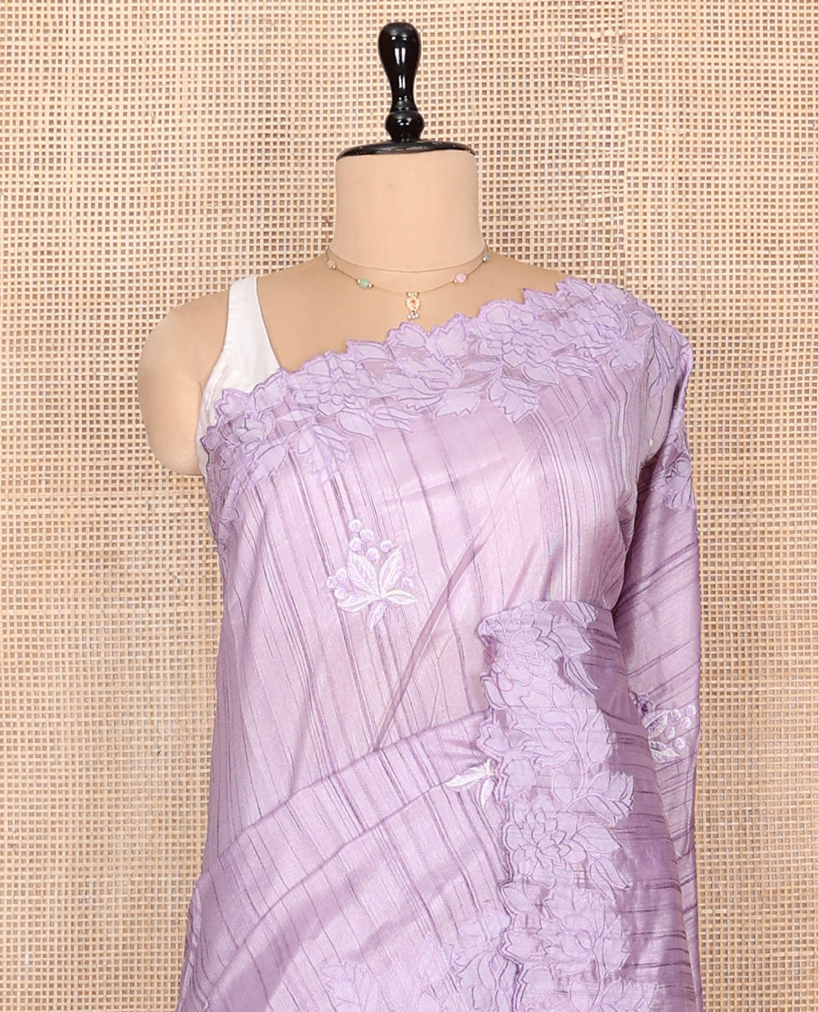 Lavender Fancy Tussar Saree, Gracefully Embellished with Floral Embroidery, a Scallop Embroidered Border, and a Matching Blouse