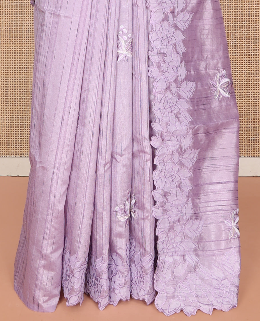 Lavender Fancy Tussar Saree, Gracefully Embellished with Floral Embroidery, a Scallop Embroidered Border, and a Matching Blouse