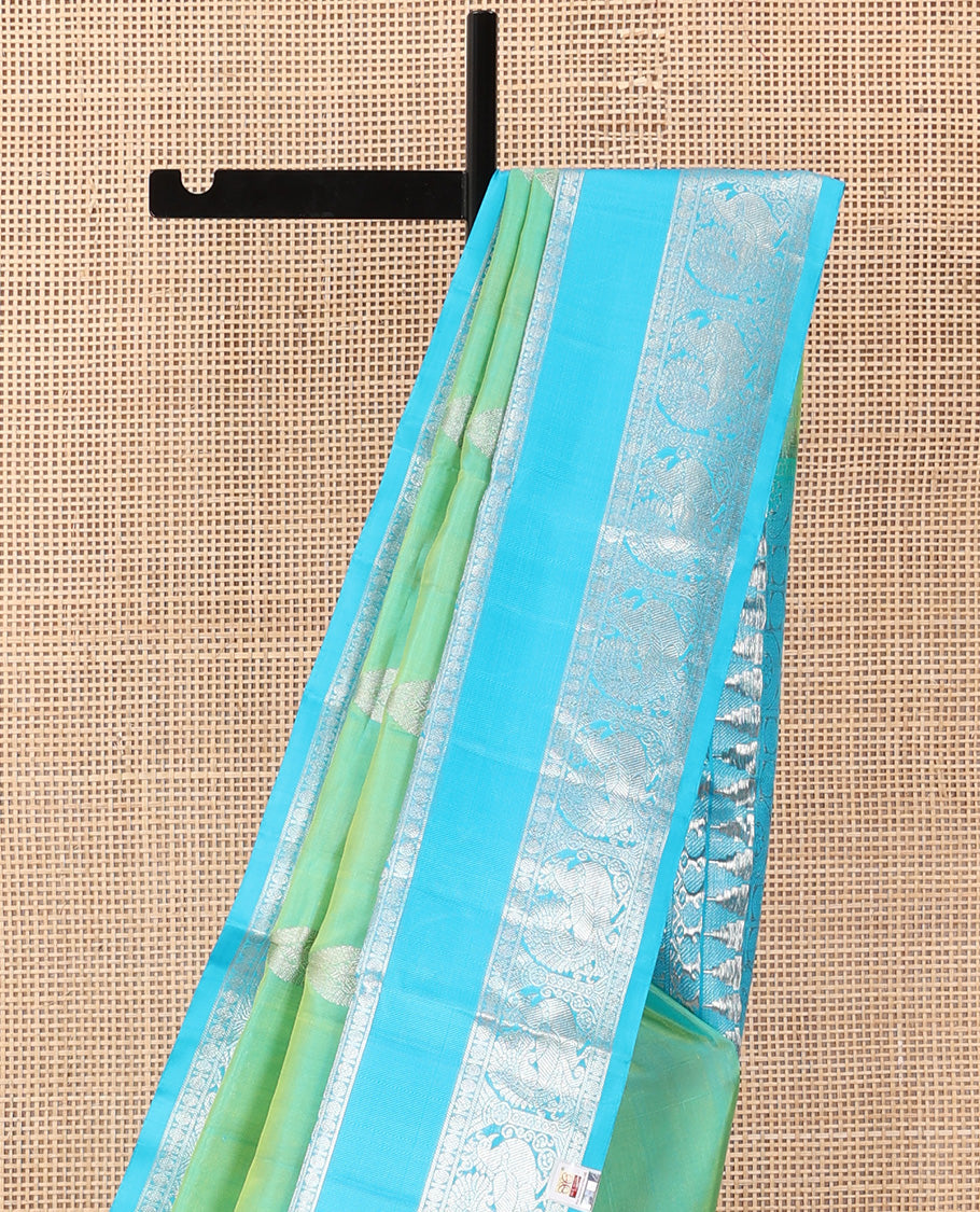 Aqua green dual-tone zari buttas Venkatagiri silk saree, contrast traditional zari rettai pettu border of peacock designs, and pallu of chakra, and rudraksham
