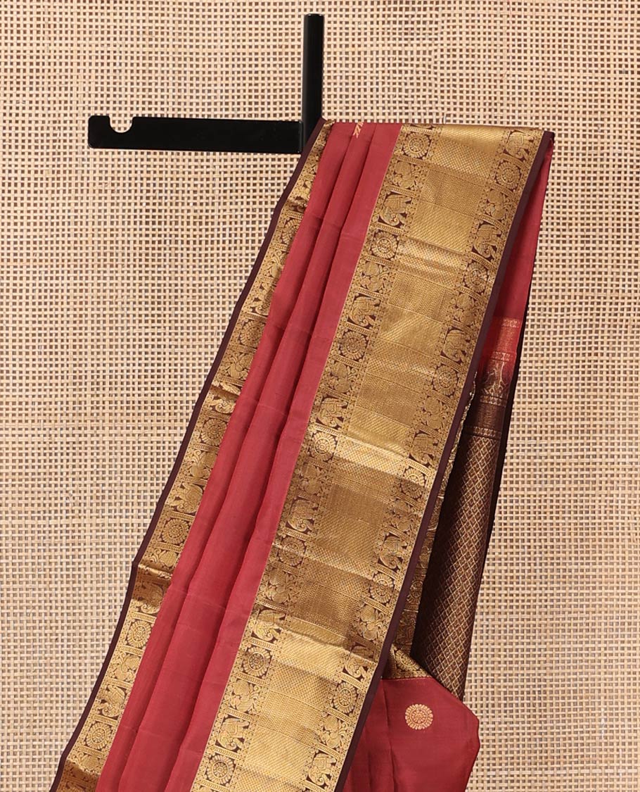 Red annam chakram buttas Vasundhara silk mix saree, contrast border of rudraksham, yaanai, mayil, chakram, vanki, mayil kann, and zari stripes, and jaal pallu