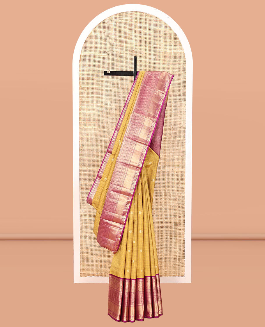 Yellow Vasundhara Silk Saree, Sparsely Sparkled with Zari Buttas and Checks, Complemented by a Contrast Border of Lavangam, Muthu, Kathir, Neli, and Mayil, Jaal Pallu, and a Contrast Blouse