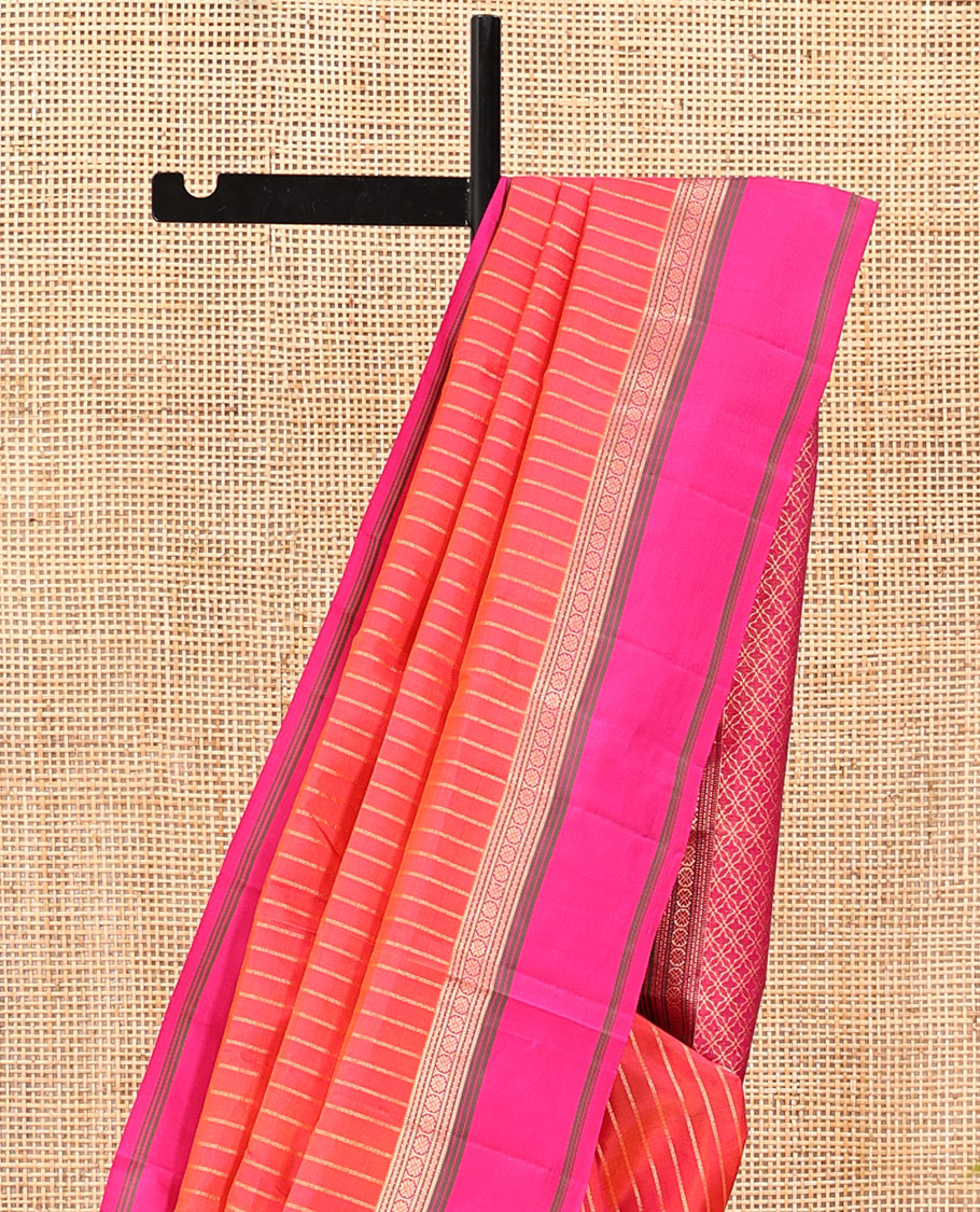 Orange Zari Striped Vasundhara Silk Saree, Contrast Kal Eragina Border of Neli, Muthu, Cross Kamalam Designs, Grand Pallu, and a Contrast Blouse