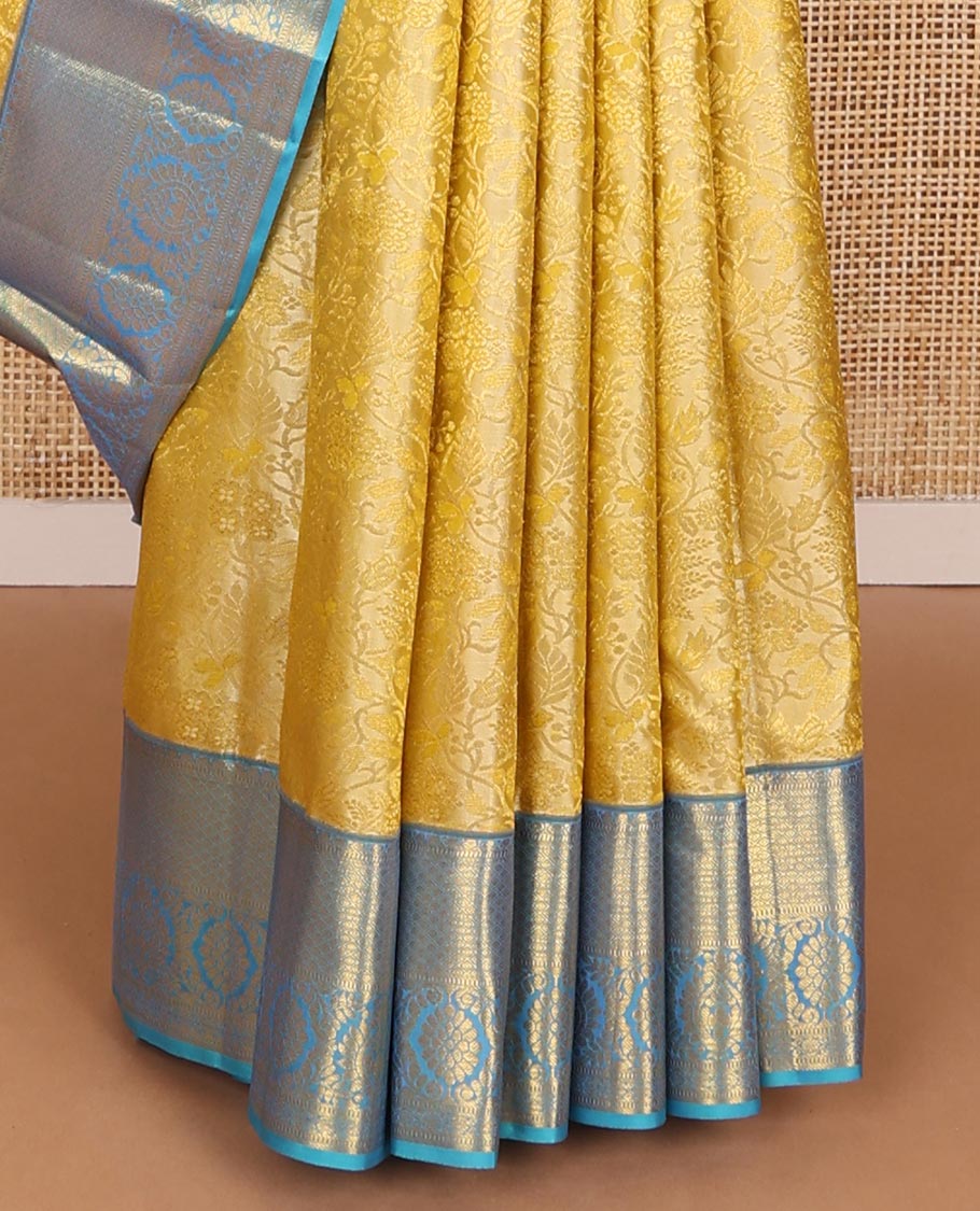 Yellow jacquard wedding silk saree, contrast zari border of muthu, jaal & floral designs & intricately designed pallu