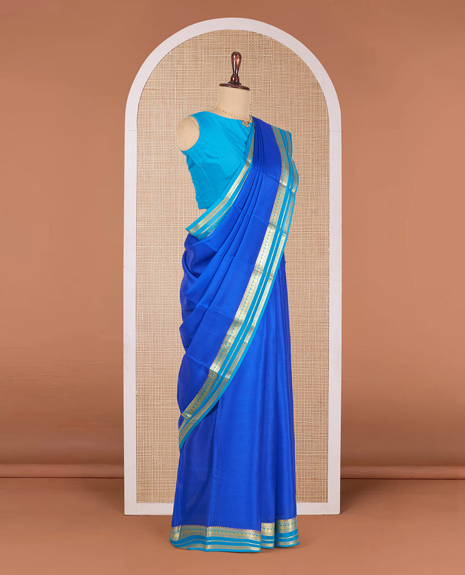 Royal Blue Plain Mysore Silk Saree, Complemented by a Contrast Border Steeped with Traditional Zari Designs, Pallu Featuring Zari Stripes, and Paired with a Contrast Blouse