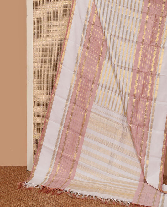 Cream-pink Kanchipuram silk saree features Muthu stripes,mayil kann, and neli designs, rettai pettu mayil kann border, and zari woven pallu