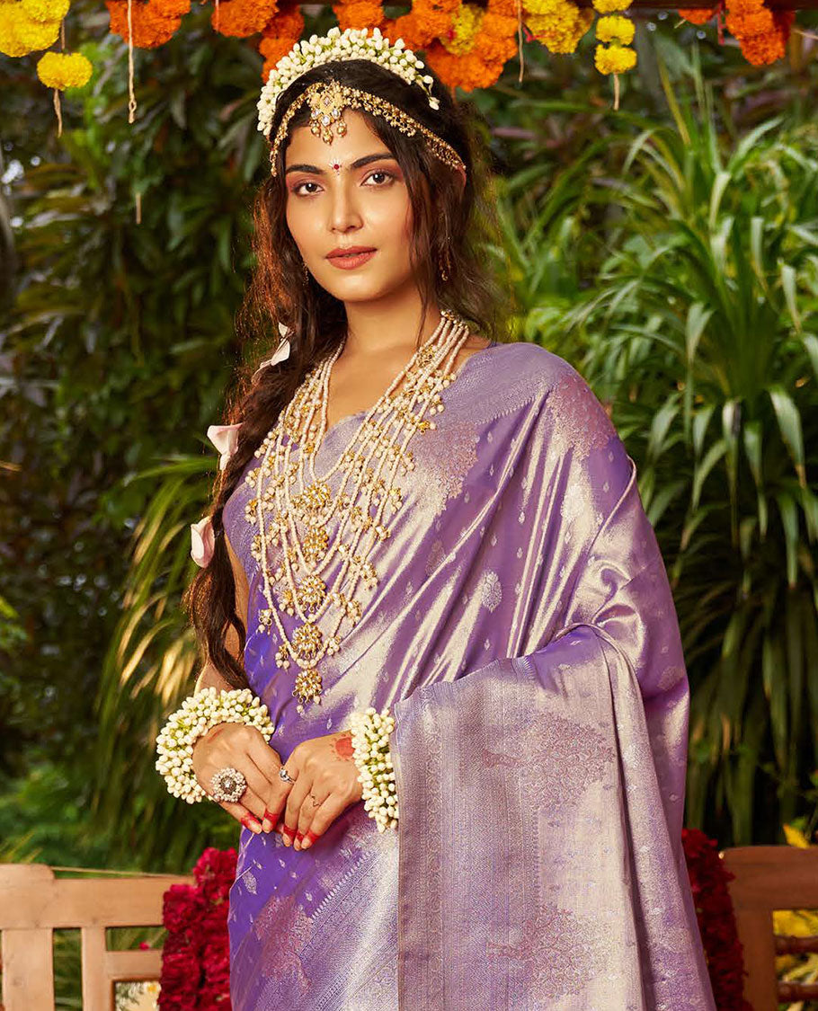 Violet Designer Catalog Saree, Majestically Detailed with Buttas All Over Its Body, Subtly Woven Border of Tree Designs, Pallu Depicts Intricate Designs, and Paired with a Matching Blouse