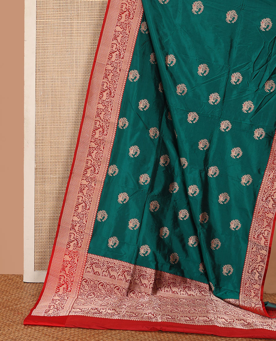 Green floral buttas katan silk saree, contrast traditional border of flora-fauna designs, and pallu of peacock, and derr motifs enclosed circles