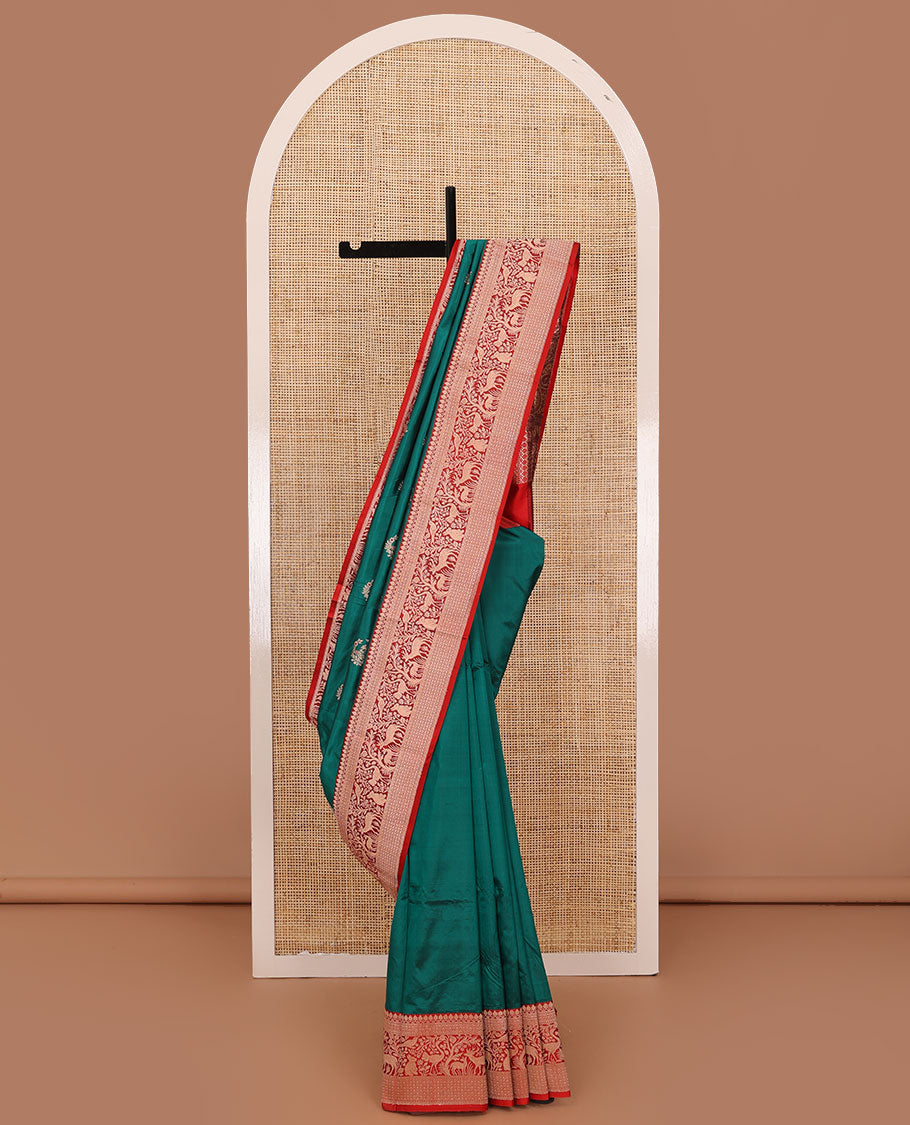 Green floral buttas katan silk saree, contrast traditional border of flora-fauna designs, and pallu of peacock, and derr motifs enclosed circles