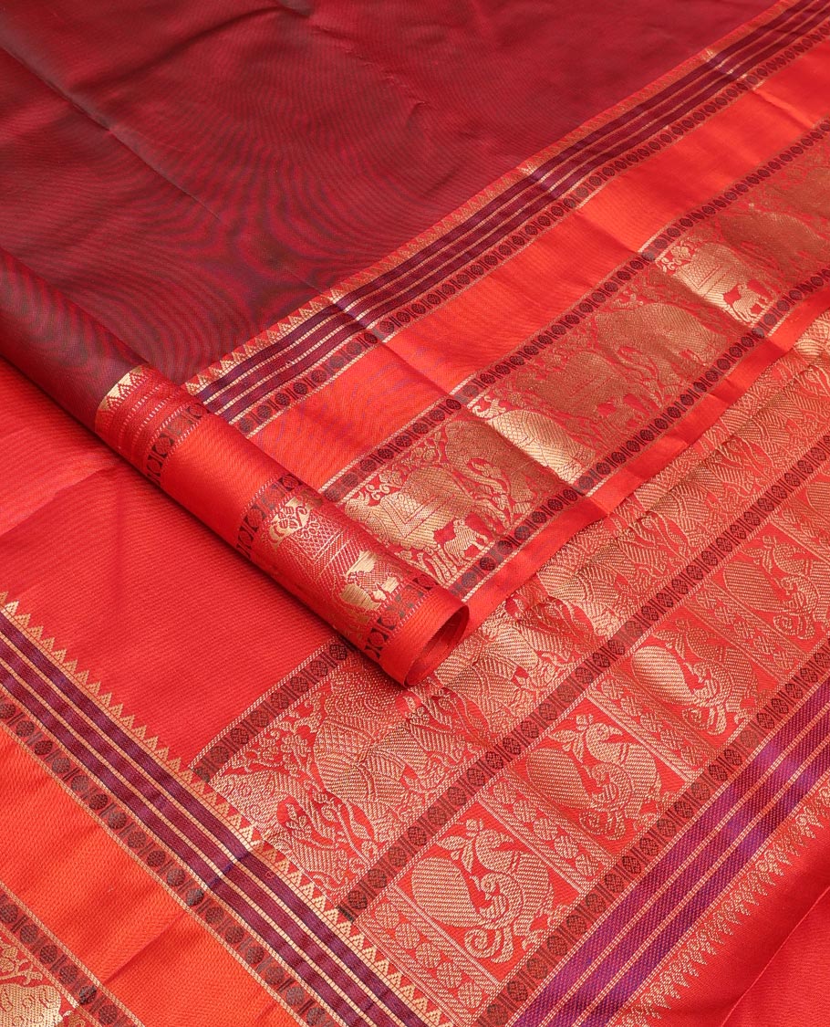 Maroon thread buttas Kanchipuram silk saree, contrast rettai pettu border of rekku, rudraksham, yaanai, and Pichwai cow designs, and pallu features Vrishabha Kunjara design