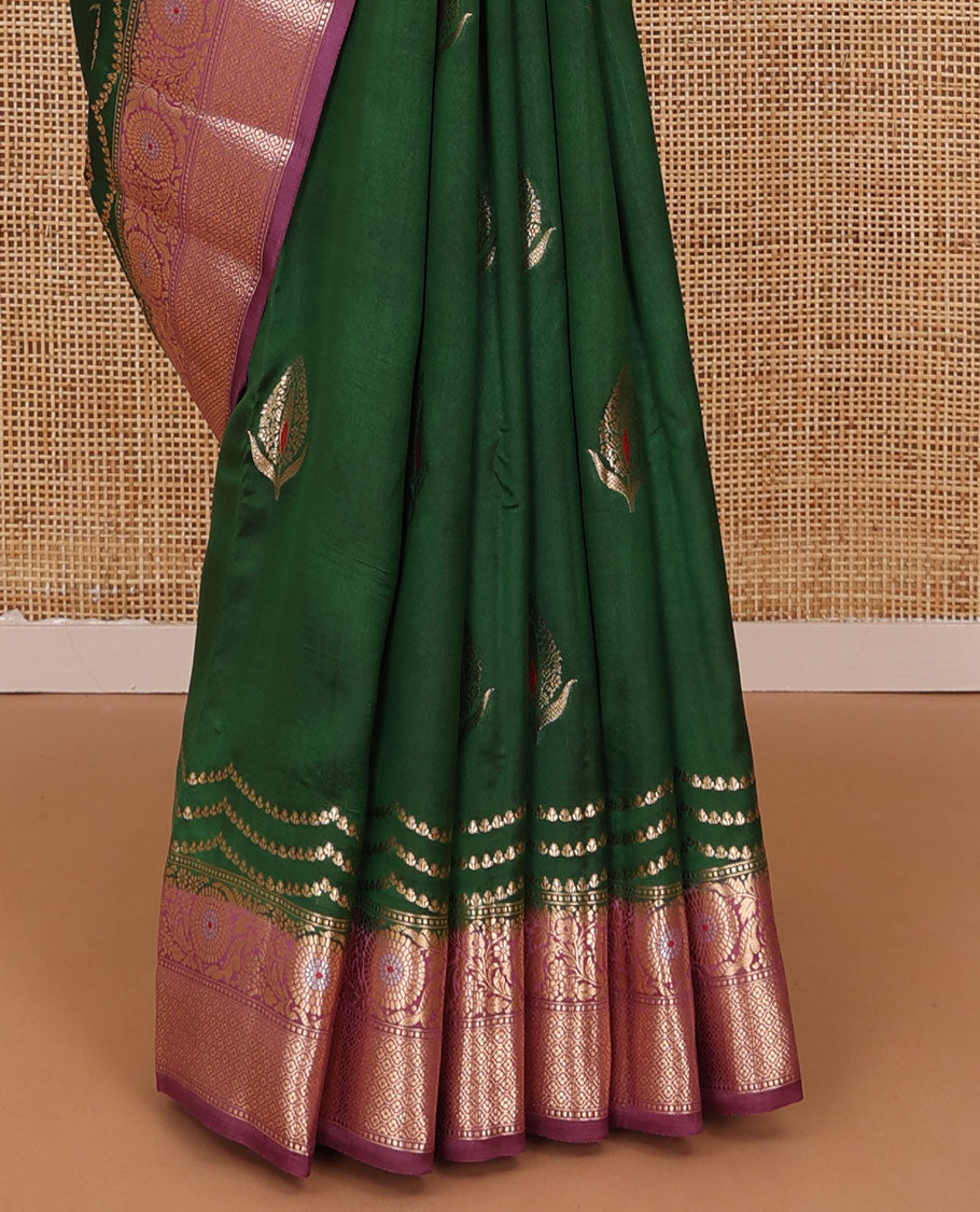 Dark green floral meena buttas raw mango silk saree, contrast floral design border creeper, and floral design pallu