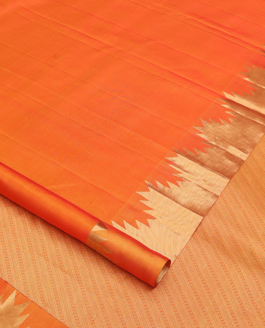 Orange plain Kanchipuram silk saree, thazampoo rekku zari border, and diagonally woven geometric patterned pallu