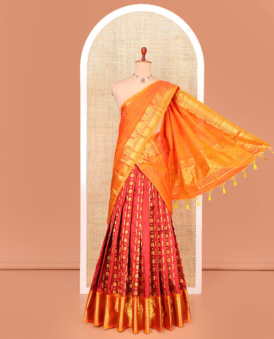 Red zari design pure-silk half-saree with contrast border of traditional zari designs, contrast zari bordered blouse, and a dhavani of manga designs