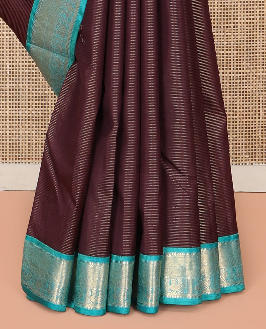 Brown Vasundhara Silk Saree, Charmingly Accented with Stripes and Zari Buttas All Over Its Body, Complemented by a Contrast Border of Rekku, Neli, Kuyil Kann, and Mayil Designs, Grand Jaal Pallu, and Paired with a Contrast Blouse
