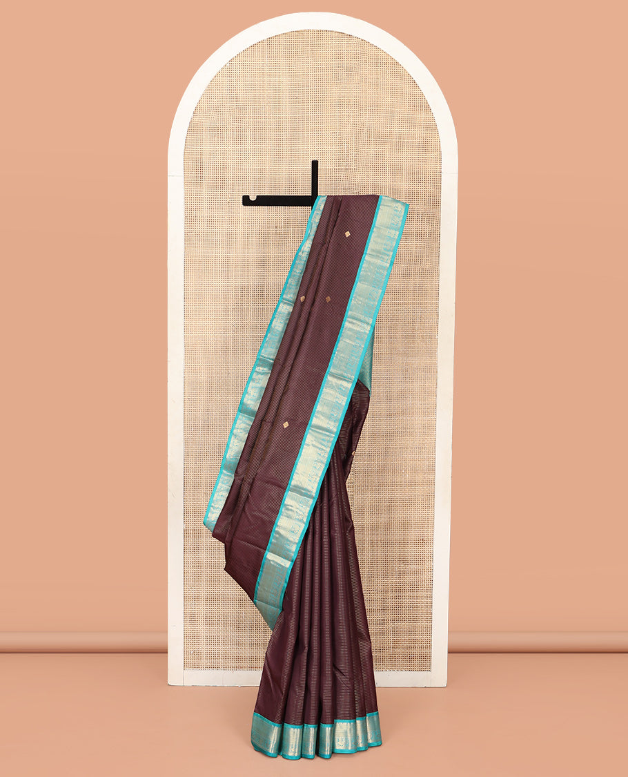 Brown Vasundhara Silk Saree, Charmingly Accented with Stripes and Zari Buttas All Over Its Body, Complemented by a Contrast Border of Rekku, Neli, Kuyil Kann, and Mayil Designs, Grand Jaal Pallu, and Paired with a Contrast Blouse