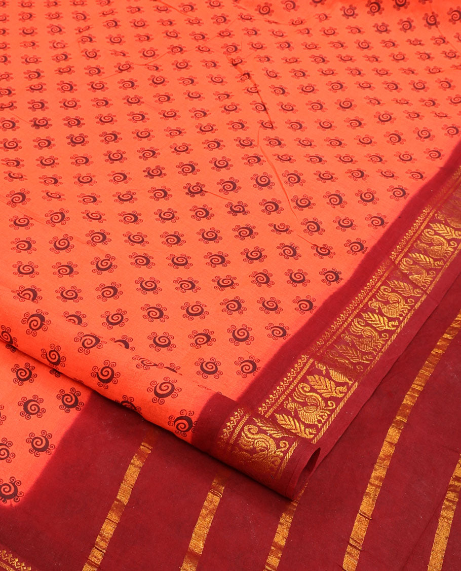 Orange buttas nine-yard cotton saree, contrast traditional zari border, and zari striped pallu