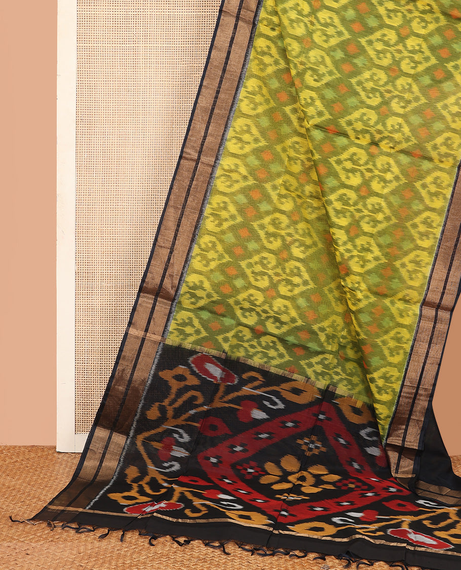 Green Pochampally Ikkat-style ogee patterned silk cotton saree, contrast bavanji zari border, and ikkat design pallu