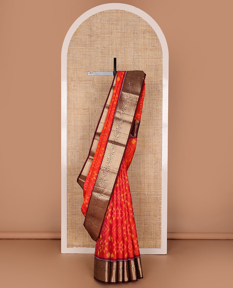 Orange jaal-patterned pure ikkat saree, contrast traditional zari kanchi border & pallu of zari geometric designs