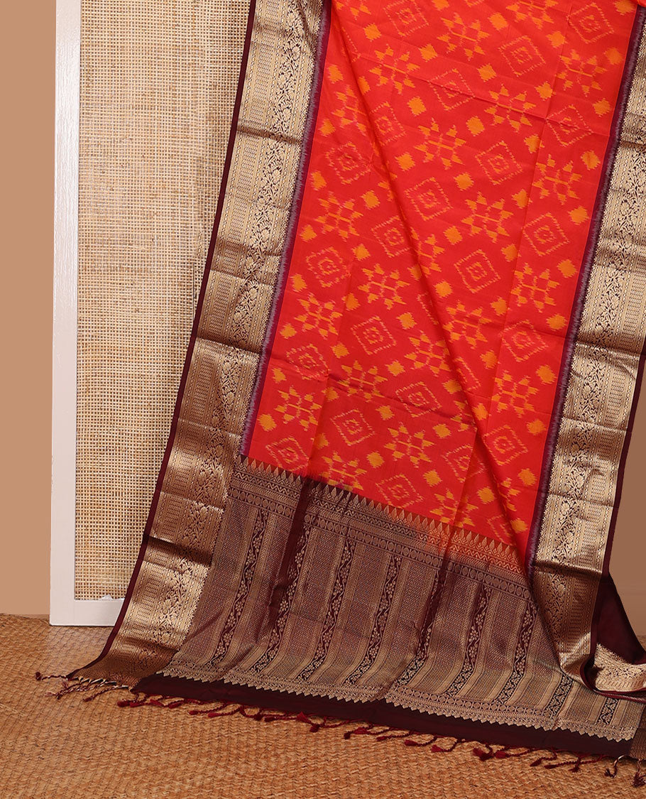 Orange jaal-patterned pure ikkat saree, contrast traditional zari kanchi border & pallu of zari geometric designs