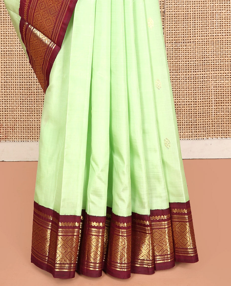 Green Kanchipuram Silk Saree, Graced with Zari Buttas, Contrast Korvai Border of Thilakam Mokku, Banaras, Muthu, and Jaal, Zari Design Pallu, and No Blouse