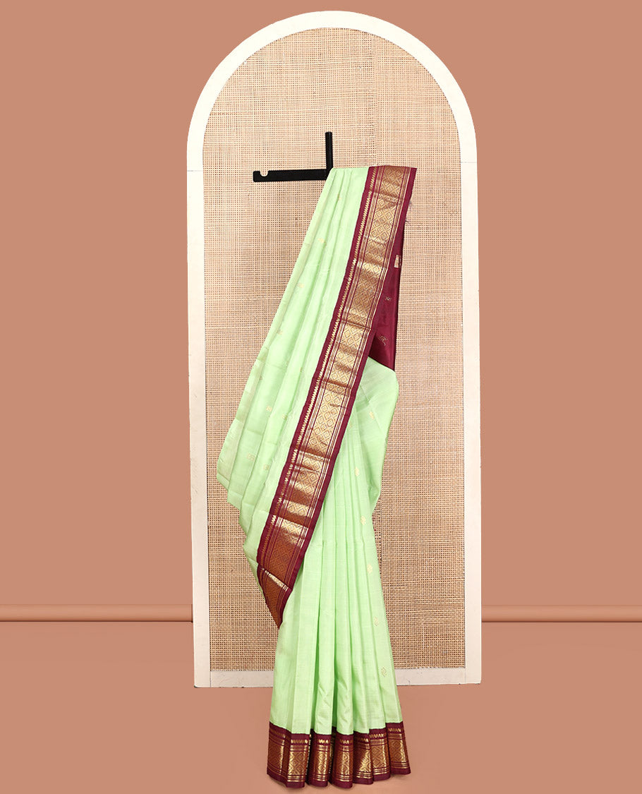 Green Kanchipuram Silk Saree, Graced with Zari Buttas, Contrast Korvai Border of Thilakam Mokku, Banaras, Muthu, and Jaal, Zari Design Pallu, and No Blouse