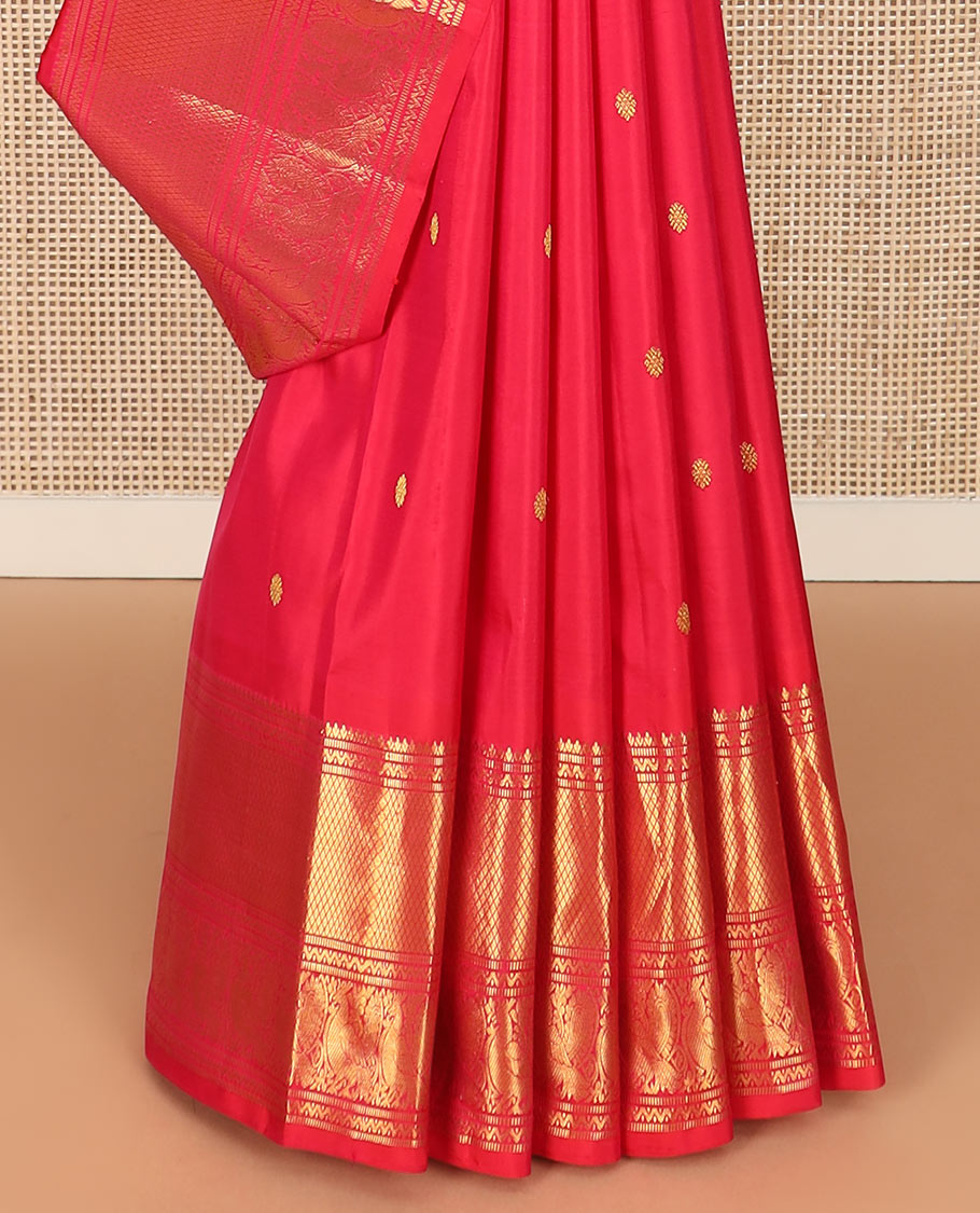 Red zari buttas Kanchipuram silk saree, zari border of muthu, neli, mayil, and mayil kann designs, and chakram design pallu