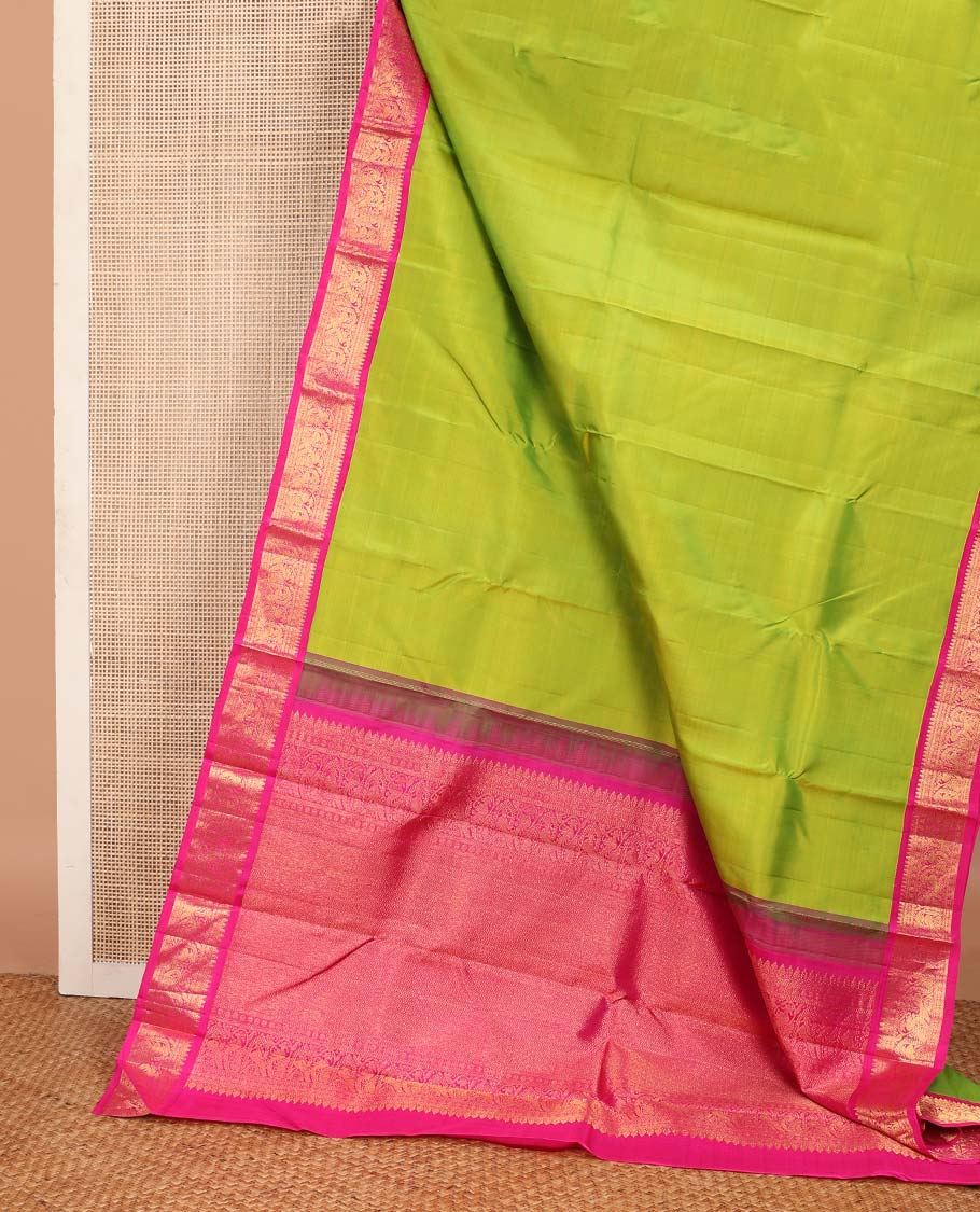 Green plain Kanchipuram korvai silk saree, contrast neer korvai border of thilakam mokku, kathir, poun, and mayil kann designs, and jaal pallu