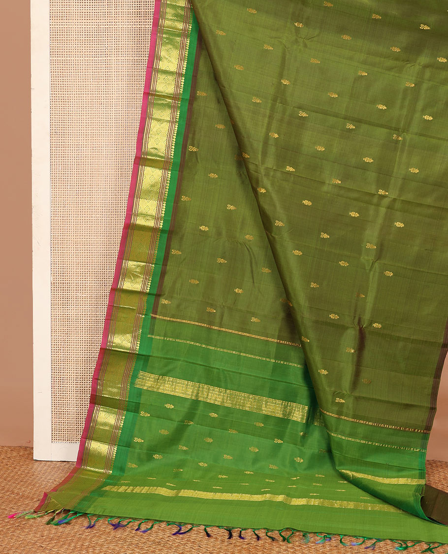 Green zari buttas Kanchipuram silk saree, contrast one-sided border of panner sombu, muthu, banaras and jaal designs, and zari design pallu