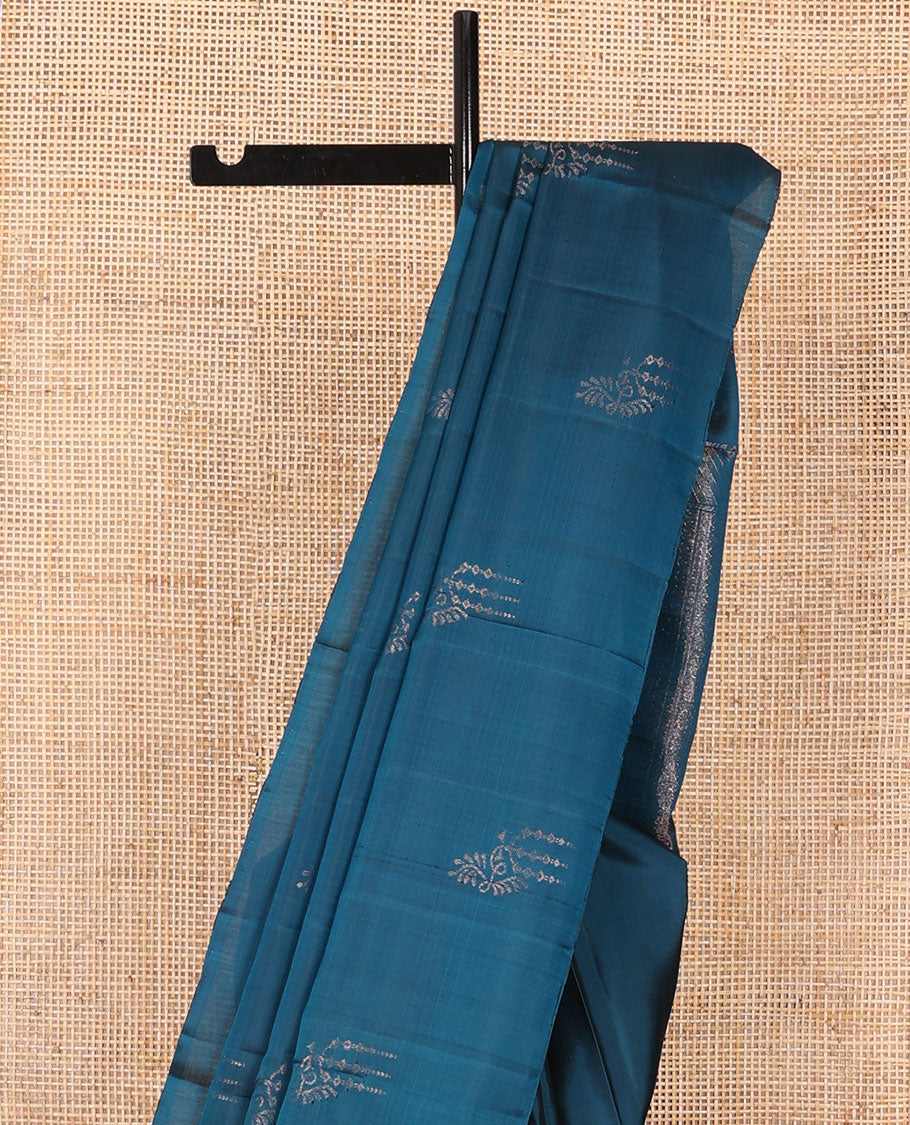 Borderless blue zari buttas soft silk saree, zari-rich pallu steeped with traditional zari designs