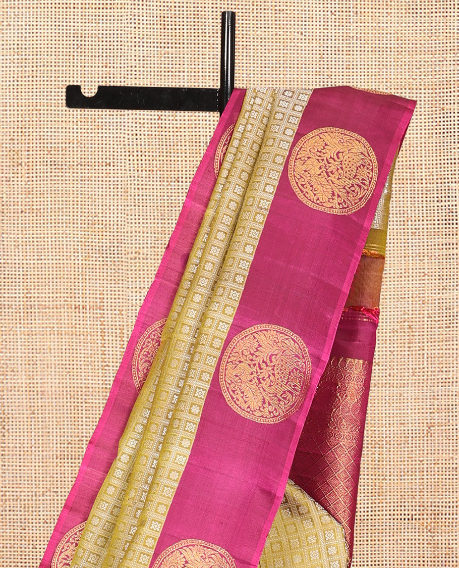 Green Embossed Parambara Silk Saree, a Contrast Border of Chakram Designs, Grand Pallu of Jaal Design, and Contrast Blouse