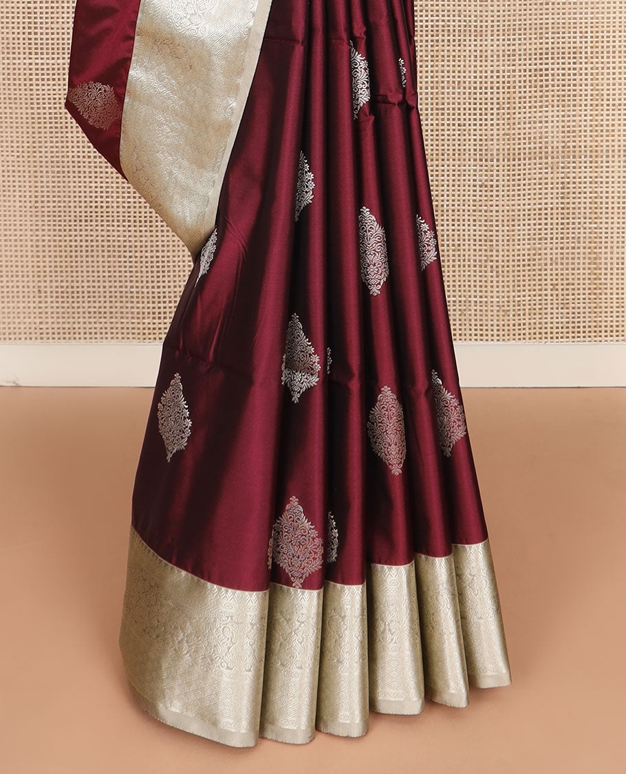Maroon zari buttas soft silk saree, contrast traditional zari design border, and pallu of jaal design