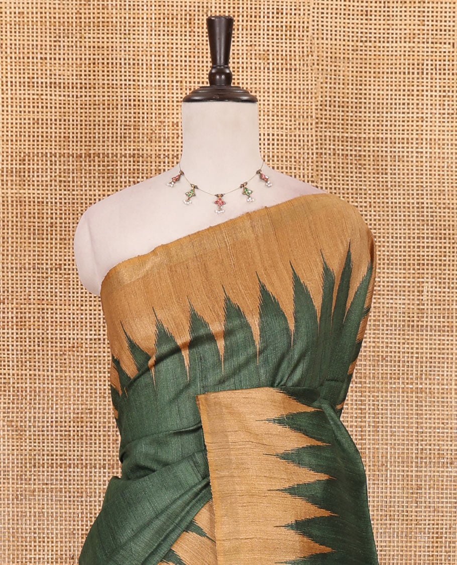 Green plain tussar silk saree, contrast temple border, and ikkat design pallu