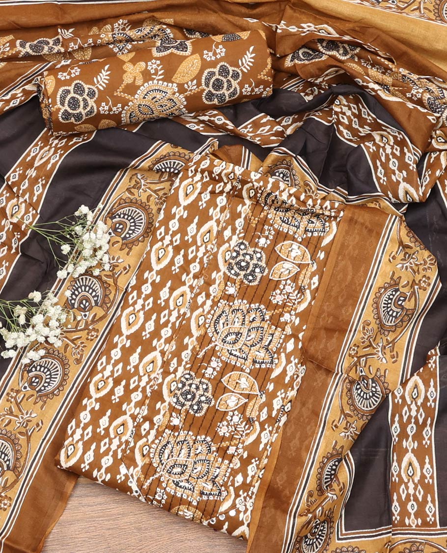 Brown Material Chudidar Set, Adorned with Intricate Designs and Thread Work Cotton Top, a Floral Printed Cotton Bottom, and Paired with an Intricately Printed Cotton Dupatta
