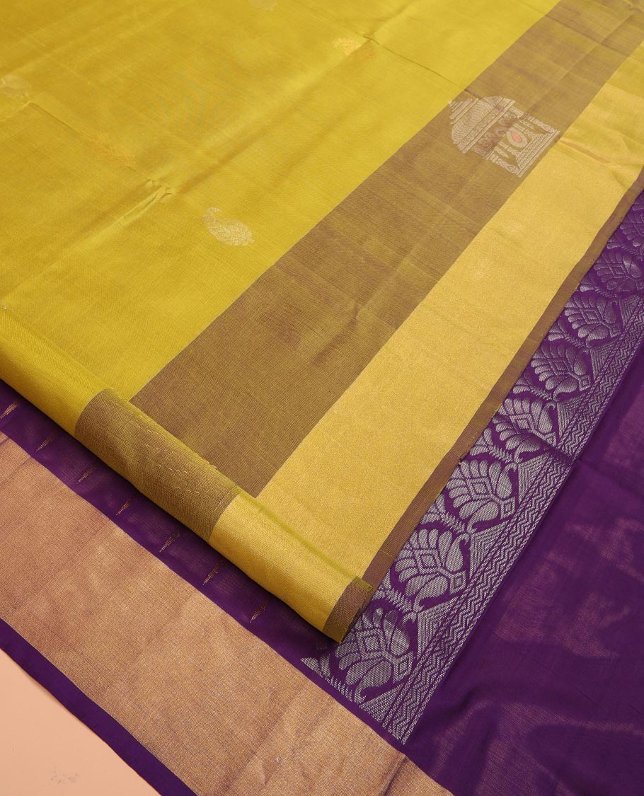 Yellow Uppada Silk Saree Decked Up with Paisley Buttas, Subtle Contrast Border of Temple Gopuram Motifs, Captivating Pallu Featuring Floral Jaal Design, and Paired with a Contrast Blouse