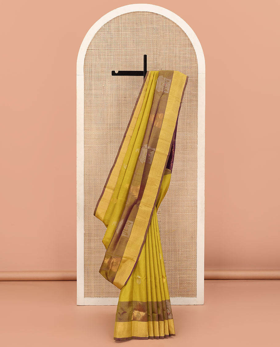 Yellow Uppada Silk Saree Decked Up with Paisley Buttas, Subtle Contrast Border of Temple Gopuram Motifs, Captivating Pallu Featuring Floral Jaal Design, and Paired with a Contrast Blouse