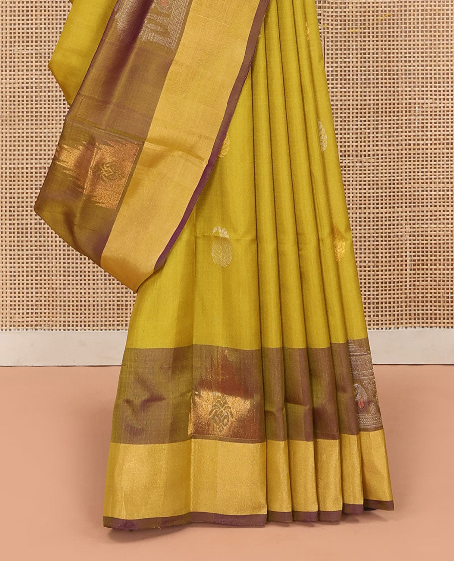 Yellow Uppada Silk Saree Decked Up with Paisley Buttas, Subtle Contrast Border of Temple Gopuram Motifs, Captivating Pallu Featuring Floral Jaal Design, and Paired with a Contrast Blouse