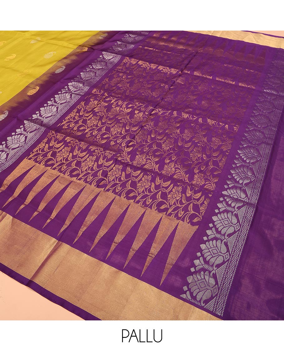 Yellow Uppada Silk Saree Decked Up with Paisley Buttas, Subtle Contrast Border of Temple Gopuram Motifs, Captivating Pallu Featuring Floral Jaal Design, and Paired with a Contrast Blouse